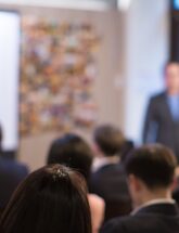 Image of people gathered for presentation