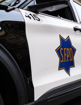 Image of side panel of police patrol vehicle