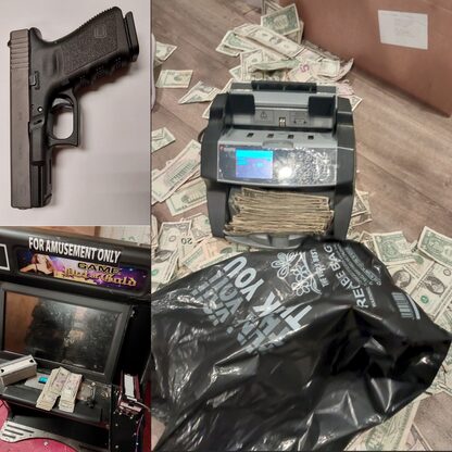 Image of firearm, gambling machines, and U.S. currency seized from illegal gambling den